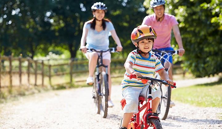 Family biking together outside